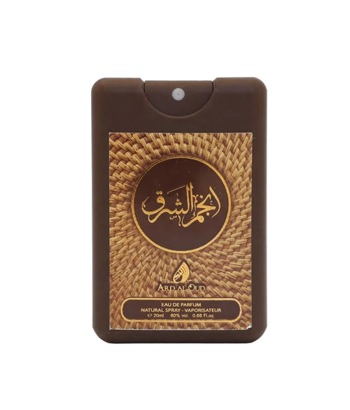 Anjam Al Sharq a dark brown rectangular perfume spray bottle with a gold and brown woven-pattern label featuring Arabic calligraphy and the brand name 'Ard al Oud.
