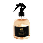 A 500ml clear spray bottle of Anar Breeze Velvet Oud Air Freshener, filled with a light amber liquid and topped with a black trigger sprayer and black label.